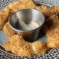 Cod Fish Nuggets · Deep fried golden cod fish nuggets served with fries.
