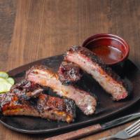 Spare Ribs · Dry rubbed and slow smoked St Louis cut spareribs finished on the grilled with our Sweet and...