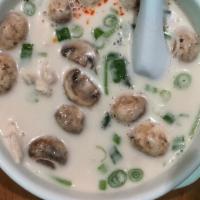 Tom Kar (Chicken) · Southern thai coconut soup, mushroom, galangal, lime and tomato.
