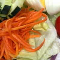 Thai Salad · Lettuce, tofu, eggs, tomatoes, cucumber, carrots, red onions, with side of peanut dressing.