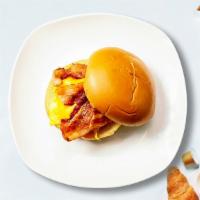 Bacon, Egg, And Cheese Sandwich · Scrambled egg, bacon, cheddar cheese, sliced tomato and caramelized onions.