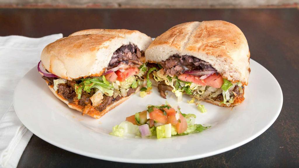 Tortas · Pressed sandwich in a Mexican bread sourced from a local Bushwick panaderia filled with Jalapeño, red onion, melted mozzarella cheese, Oaxacan black beans, lettuce, tomato and chipotle aioli.