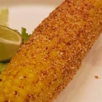 Btc Elote · Corn on the cob, dressed with chipotle mayo, cotija cheese and chile piquin powder