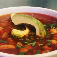 Pozole De Pollo · Mexican chiles- tomato chicken broth, with homony, tomatoes, peppers, onions, topped with ci...
