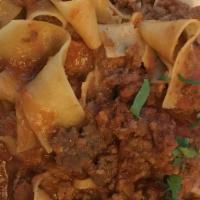 Pappardelle Bolognese · wide egg noodles, bolognese sauce, ricotta cheese