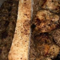 One Chicken Kofta & One Beef Kofta · Ground beef or chicken kebab served with rice, salad, and bread.