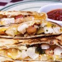 Quesadillas · Fresh flour tortillas stuffed with pico de gallo, juicy grilled cicken and Mexican cheese. S...