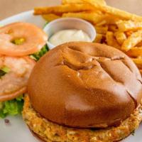 Salmon Burger · Homemade Alaskan salmon burger with zucchini and carrot
served with lettuce, tomato, red oni...