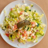 Greek Salad · Romaine lettuce, tomato, cucumber, red onion, feta and grape leaves with virgin olive oil an...