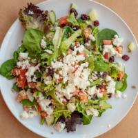 Goat Cheese Salad · Mixed greens, tomato, cucumber, sunflower seed, cranberry with extra virgin olive oil and le...