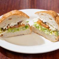 Tortas · Mi Cholulita Bella favorite: Mexican roll with choice of meat, cheese, avocado, jalapeño, on...