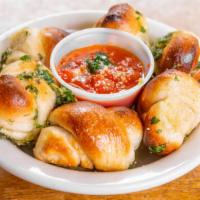 Garlic Rolls With Tomato Sauce · Six  pieces.