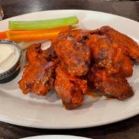 Buffalo Wings · Served with blue cheese dipping sauce.