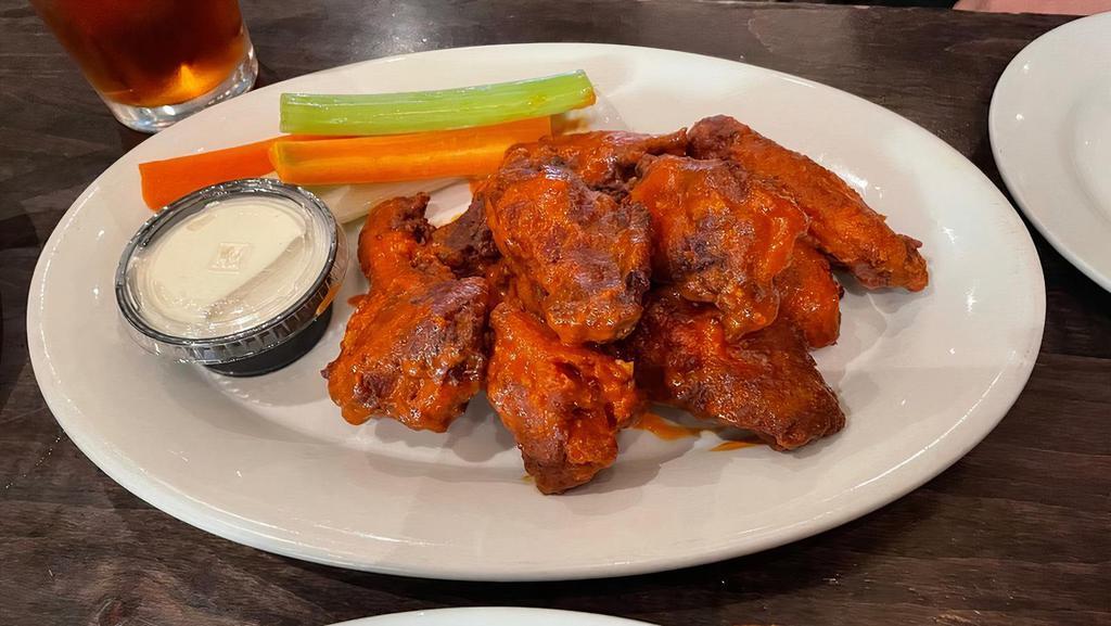 Buffalo Wings · Served with blue cheese dipping sauce.