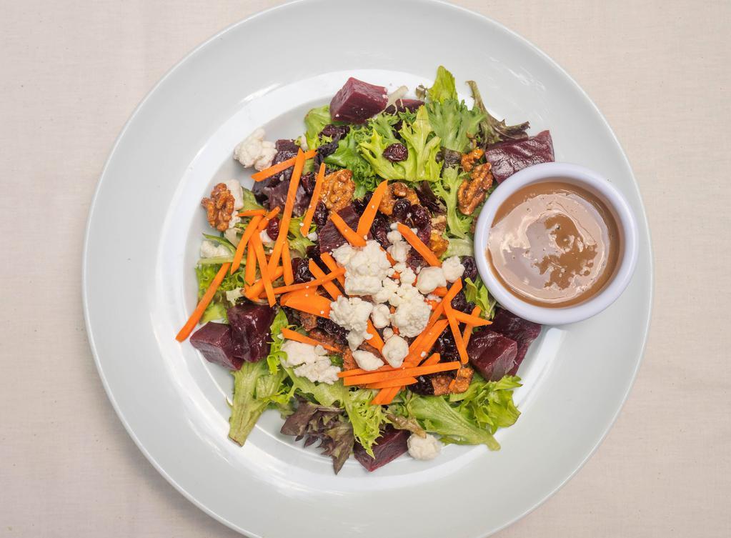 Roasted Beet & Goat Cheese Salad · Mesclun field greens, julienne carrots, candied walnuts and dried cranberries with a balsamic vinaigrette.
