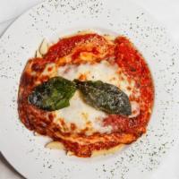 Chicken Parmigiana · Fresh tomato sauce and melted mozzarella.