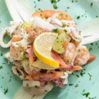 Seafood Salad · Gluten free. Shrimp, calamari, baby octopus, celery, onions and tomato in a homemade lemon d...