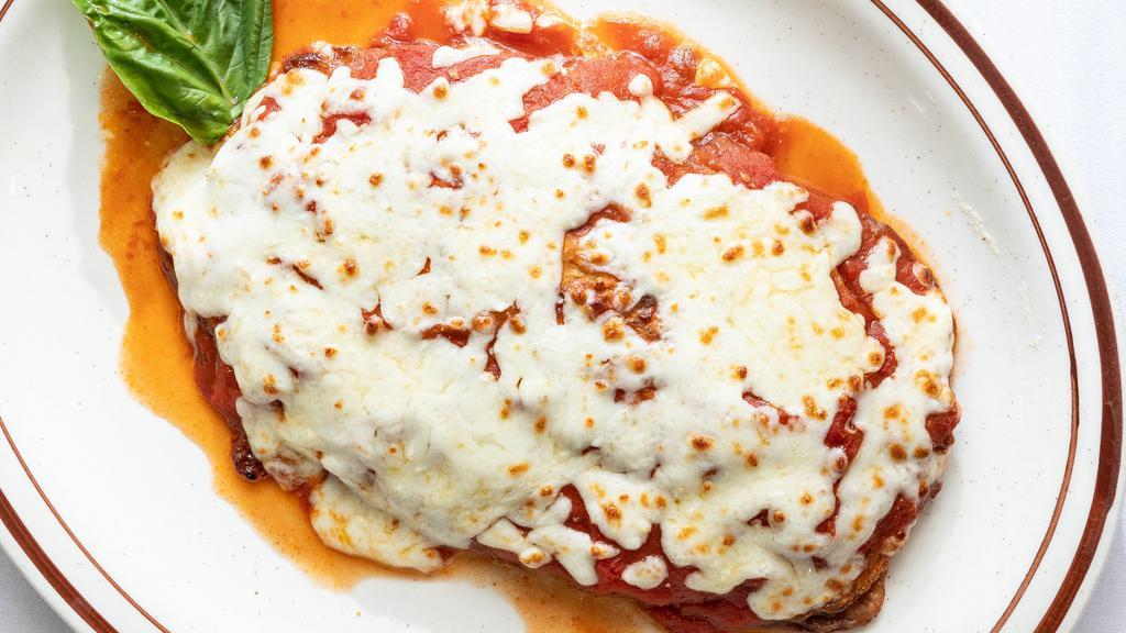 Eggplant Parmigiana · Can be made gluten free and thinly sliced, our eggplant is layered in our marinara sauce then topped with melted mozzarella cheese. Served with a house salad.