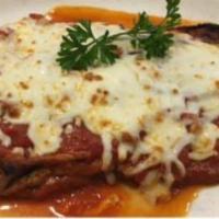 Veal Parmigiana · Can be made gluten free. Thinly sliced veal breaded and seared baked with marinara sauce and...