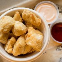 Popcorn Chicken · Gluten-free. Served with your choice of two sauces.