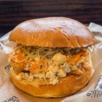 Buffalo Bleu Bird · Spicy buffalo sauce, crumbled bleu cheese and crispy slaw. With your choice of fried chicken...