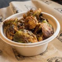 Family Style Brussels Sprouts · Crispy fried brussels tossed with mint and chilies. Serves 4-5 people.