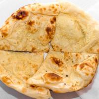 Garlic Naan · Most popular. Unleavened bread stuffed with fresh garlic, baked in the clay oven.