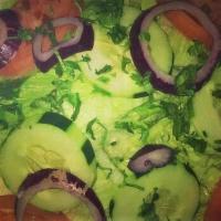 Green Salad · Cucumbers, tomatoes, onions and lettuce with homemade dressing or Italian dressing.