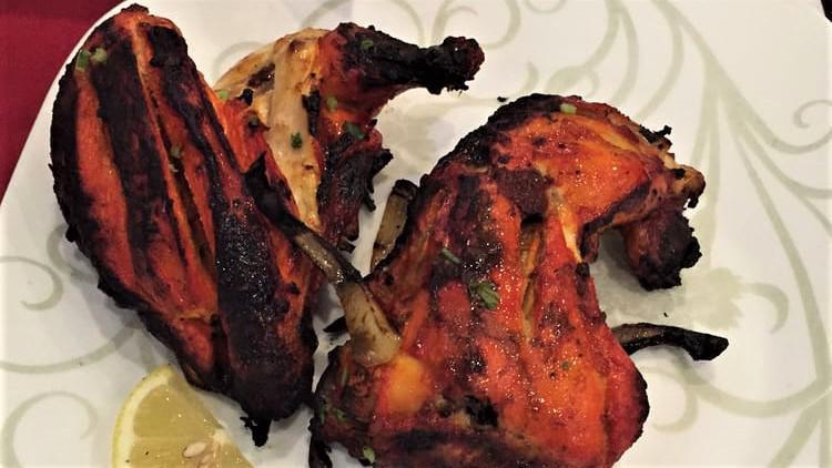 Chicken Tandoori · Chicken marinated in mild spices and grilled in clay oven.
