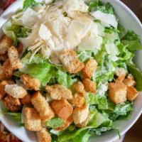 Caesar Salad · Romaine lettuce, shaved Parmesan and homemade croutons with classic Caesar dressing.