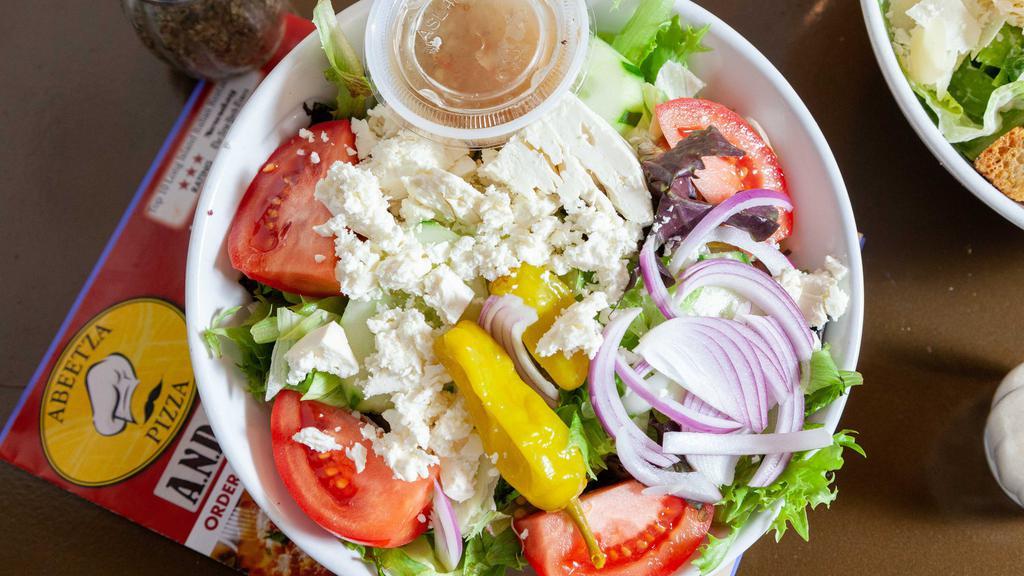 Greek Salad · Mixed greens, tomato, cucumber, olives, onion, pepperoncini and feta cheese.