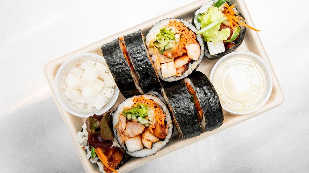 Spicy Gochujang Chicken Kimbap · White or brown rice, seaweed, all-natural gochujang chicken, carrots, pickled radish, red leaf lettuce, cucumbers, sesame oil, sesame seeds