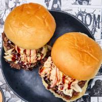 Two Bulgogi Ribeye Sliders · Two of our thinly sliced soy marinated USDA Choice ribeye beef in a bulgogi marinade with a ...