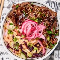 Gyu Beef Don · Thinly sliced American beef in a bulgogi marinade served with purple cabbage slaw marinated ...
