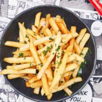 Truffle Fries · Crispy handcut fries with sea salt and white truffle essence.
