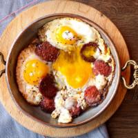 Turkish Sunny Side Eggs With Soujouk · Three farm eggs with Turkish beef soujouk.