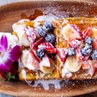 French Toast · New! Served with fresh berries and maple syrup.