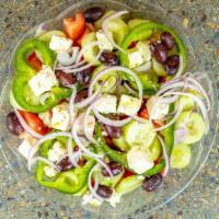 Village Salad · (Horiatiki) feta, tomatoes, cucumbers, bell peppers, red onions, and kalamata olives, drizzl...