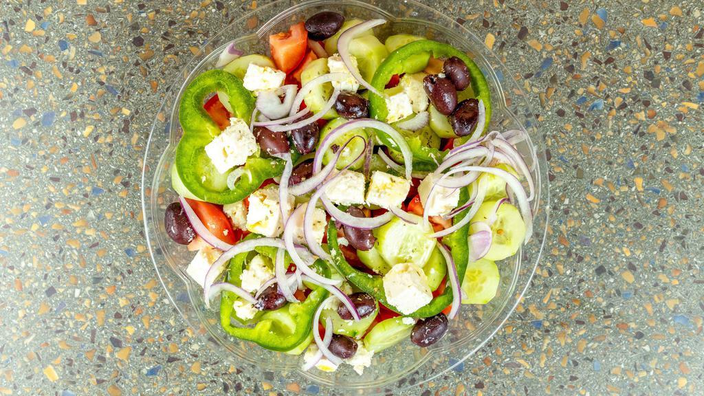 Village Salad · (Horiatiki) feta, tomatoes, cucumbers, bell peppers, red onions, and kalamata olives, drizzled with extra virgin olive oil and oregano (no lettuce).