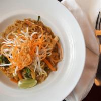 Pad Thai · Sautéed thin rice noodles with smoked tofu, egg, bean sprouts, crushed peanuts, and scallions.