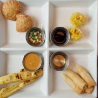 Warwick Sampler (2 Pcs.) · A combination appetizer of chicken satay, spring rolls, curry puff, and dumplings served wit...