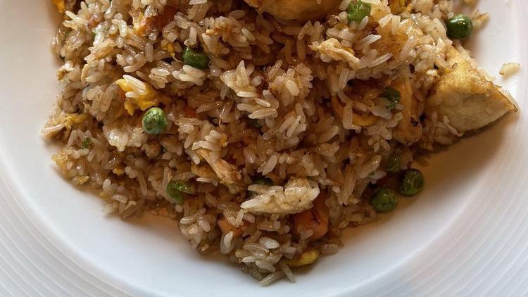 Thai Fried Rice · Egg, onions, scallions, tomatoes, peas, and carrots.