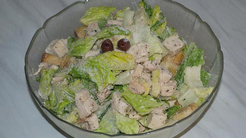 Caesar Salad With Roasted Chicken · Chopped Romaine Hearts • House Croutons • Pecorino Romano Cheese • Roasted Chicken Breast • Served with Savory Caesar Dressing