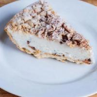 Cannoli Pie Slice · A flakey crust made of cannoli shell filled to the brim with cannoli cream. Each pie is topp...