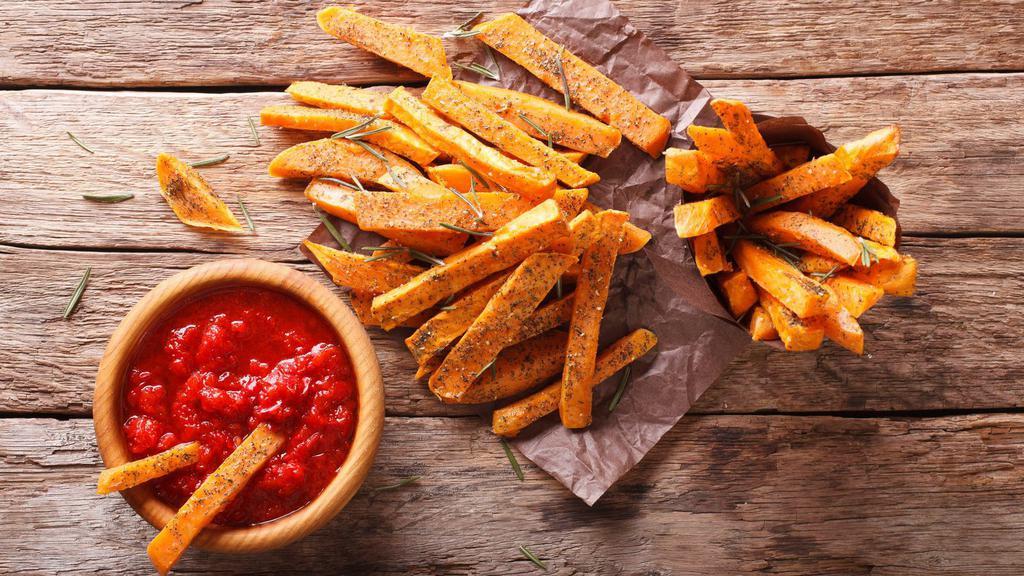 Sweet Potato Fries · Golden-crispy sweet potatoes fried and salted to perfection.