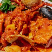 Capellini Alla Lombardi · Mussels, shrimp, and clams in a light marinara sauce.