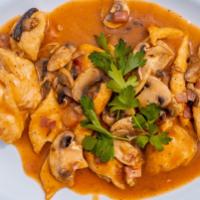 Chicken Marsala · Served with mushrooms & prosciutto, sautéed in a marsala wine sauce.