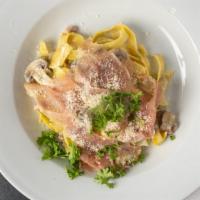 Paglia & Fieno Alla Papalina Pasta · Prosciutto, peas mushroom sauce, egg noodle with spinach.