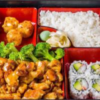 Chicken Bento Box · Served with steamed rice california roll four pieces and shrimp dumplings three pieces.