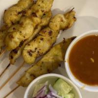 Chicken Satay · Grilled aromatic chicken fillets on skewers served with peanut sauce & cucumber salad.